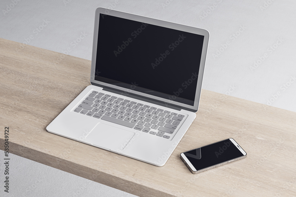 Poster close up of empty laptop and smartphone on wooden desktop, mock up place on screen, concrete floorin