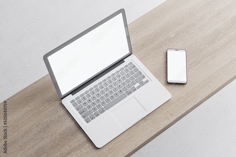 Poster close up of empty white laptop and mobile phone on wooden desktop, mock up place on screen, concrete