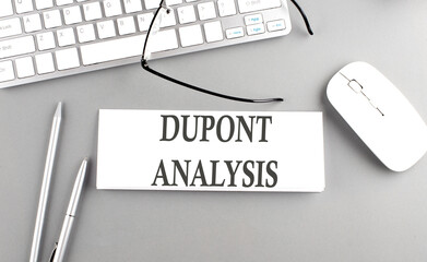 DU PONT ANALYSIS text on paper with keyboard on grey background