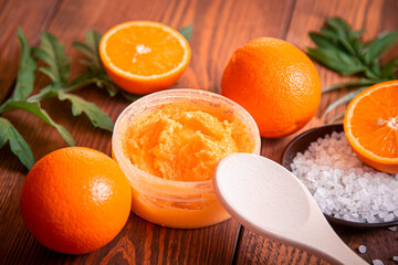 Orange scrub for face or body. Cosmetic product made of natural ingredients.