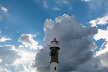 Lighthouse on the island of Poel on the Baltic Sea with big clouds and sky
