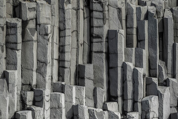 Vertical basalt column background pattern, showing the geometric hexagonal basalt rocks of...