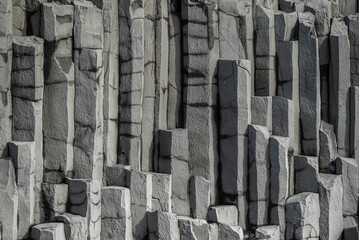 Vertical basalt column background pattern, showing the geometric hexagonal basalt rocks of Reynisfjall mountain, Reynisfjara beach, Iceland