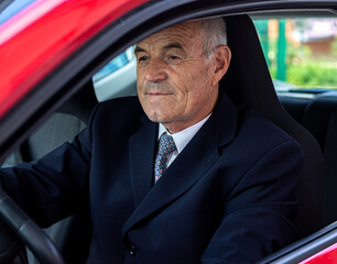portrait of a senior businessman in the car