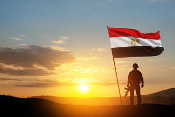Silhouette Of A Solider Against the Sunrise in desert . Concept - armed forces of Egypt. Egypt...