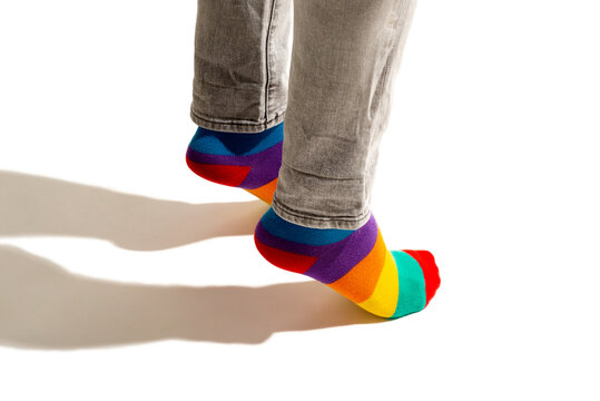 Multicolored LGTBI sock on a background of orange and white circles
