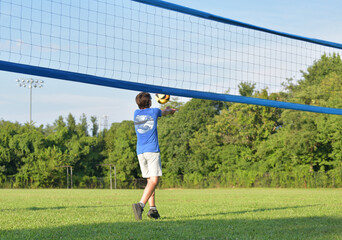 Volleyball player setting the ball outdoors