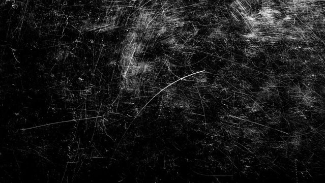 flickering white scratches with spots on a black background