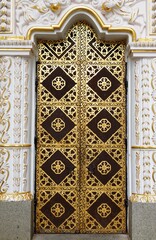 Ornamented gilded door of the Dormition cathedral of Kyiv Pechersk Lavra (Kiev Monastery of the Caves) in Kiyv, Ukraine