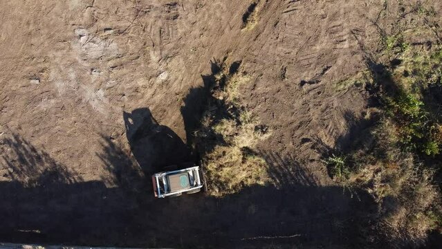aerial view of small tractor prepare construction site to build house