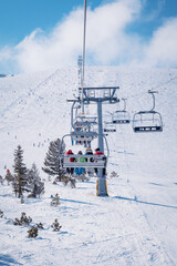 Chair lift in the ski resort of Bansko, Bulgaria. Winter landscape in the Pirin mountains