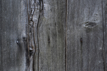 Dark stained, distressed wooden floor board texture. Rustic grey wooden textured wall background