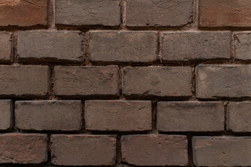 Old brick wall with ruined bricks. Aged grunge wall background. Vintage Texture. Vertical Web banner or Wallpaper With Copy Space for design.