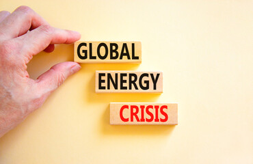 Global energy crisis symbol. Concept words Global energy crisis on wooden blocks. Businessman hand. Beautiful white table white background. Business and global energy crisis concept. Copy space.