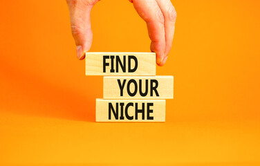 Find your niche symbol. Concept words Find your niche on wooden blocks. Businessman hand. Beautiful...