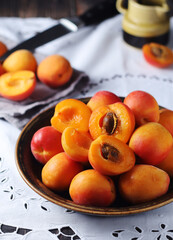 Fresh ripe apricots in bowl in rustic style