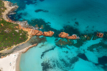 Beautiful summer seascape from air. Turquoise sea water with sand beach and rocks from top view,...