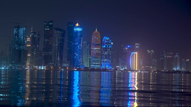 Doha, Qatar- May 5,2022 : Doha skyline with many towers during the night.