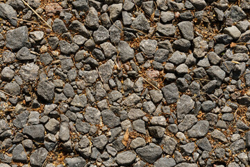Gravel road texture. Gravel and fallen leaves