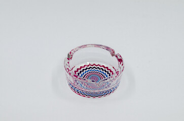 Colored glass ashtray. Glass ashtray isolated on white background.
