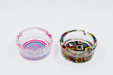 Colored glass ashtray. Glass ashtray isolated on white background.
