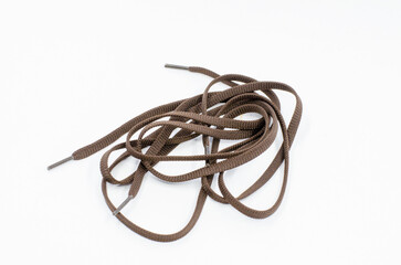shoelaces on a white isolated background. Brown shoelaces.
