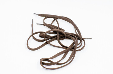 shoelaces on a white isolated background. Brown shoelaces.
