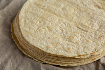 Homemade Wheat Flour Tortillas in a Stack, side view.
