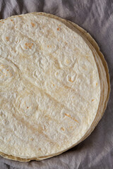 Homemade Wheat Flour Tortillas in a Stack, top view. Flat lay, overhead, from above.