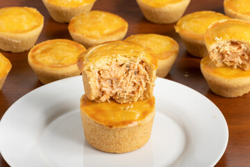 Empadinha de frango, typical appetizer of Brazilian cuisine, visible filling
