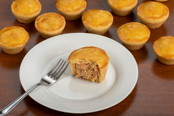 Empadinha de frango, typical appetizer of Brazilian cuisine, visible filling
