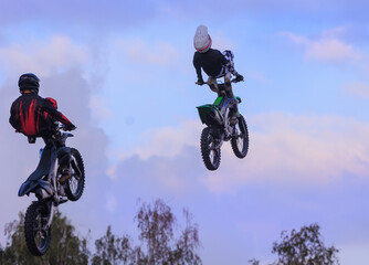Moto freestyle jump riders on a motorcycle