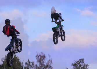 Obraz premium Moto freestyle jump riders on a motorcycle