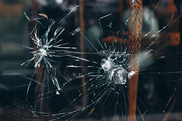 Cracks in the glass . Bullet hole on glass . Crime scene background