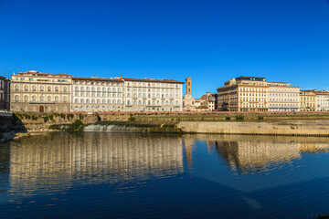 Fototapeta premium Florence, Italy. Picturesque landscape with a dam on the Arno river 