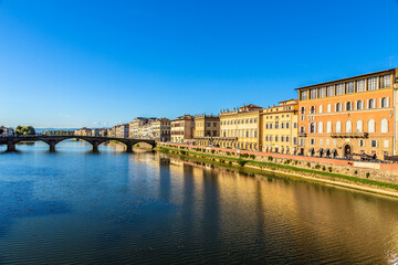 Fototapeta na wymiar Florence, Italy. Scenic view of the promenade and Ponte alla Carraia bridge