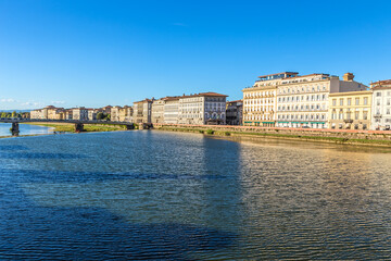 Obraz premium Florence, Italy. Embankment of the Arno River and Amerigo Vespucci Bridge