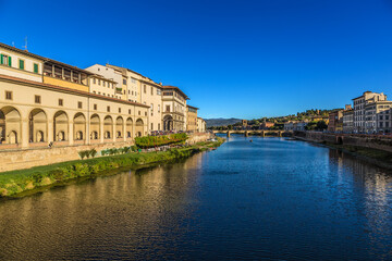 Fototapeta na wymiar Florence, Italy. Scenic view of the embankment of the Arno river with medieval buildings