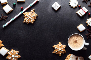Obraz na płótnie Canvas Christmas image of hot cocoa chocolate and cookies laid flat view from top