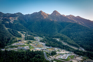 Rosa Khutor aerial panoramic view. Evening landscape in the mountains of the Caucasus. Sochi, Russia