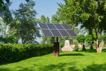 Solar panels in public park backgound. Photovoltaic modules for renewable energy, system of...