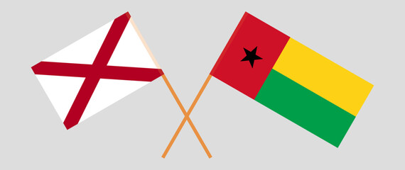 Crossed flags of The State of Alabama and Guinea-Bissau. Official colors. Correct proportion