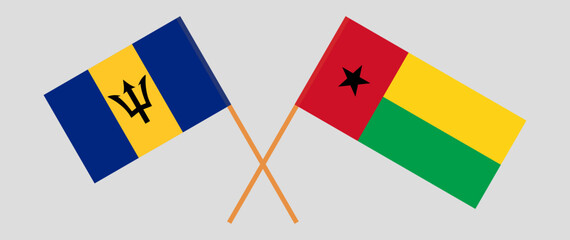 Crossed flags of Barbados and Guinea-Bissau. Official colors. Correct proportion