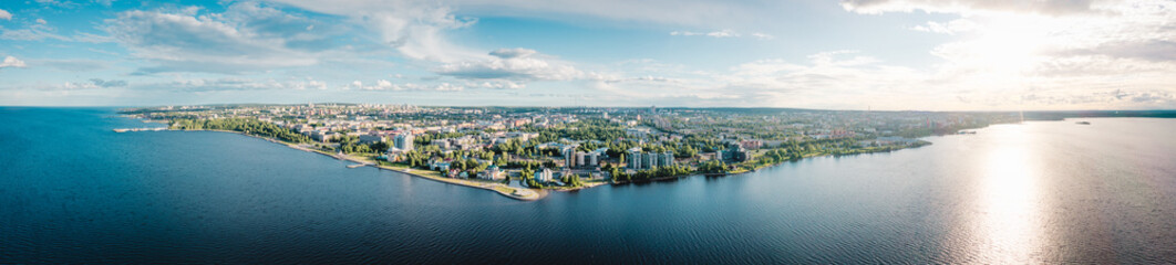 Fototapeta na wymiar Aerial panorama of the embankment of Petrozavodsk., Russia, the administrative center of Republic of Karelia. Sunset on Lake Onega