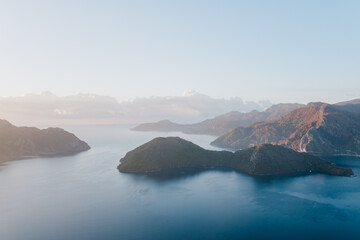 Landscape at sunrise overlooking the mediterranean sea and mountains. View of Turunk and Keci island. Turkey in summer, Marmaris area
