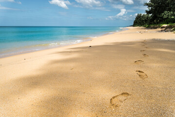 Fototapeta na wymiar Footprints on Natai Beach