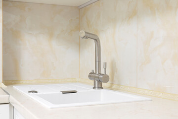 Faucet with granite sink in the kitchen