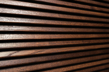 Dark wooden blinds close-up texture
