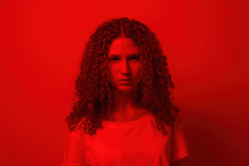 Portrait of serious teenage girl looking at camera