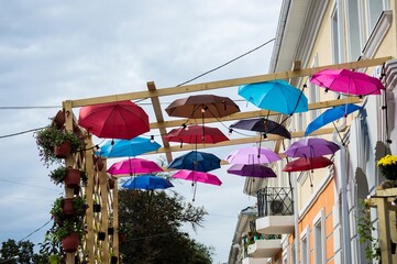 Rows of colorful umbrellas floating in air